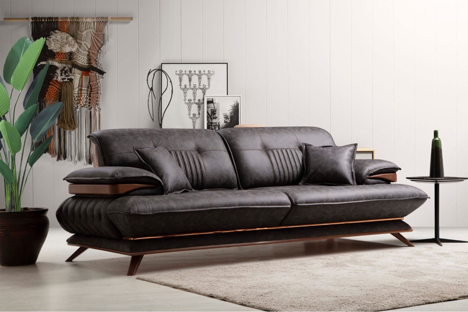 Skulpturales Ledersofa in Anthrazit mit Walnuss-Details
